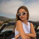 Model wearing PAIGE sunglasses in Pearl
