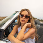 Model wearing PAIGE sunglasses in Tortoise