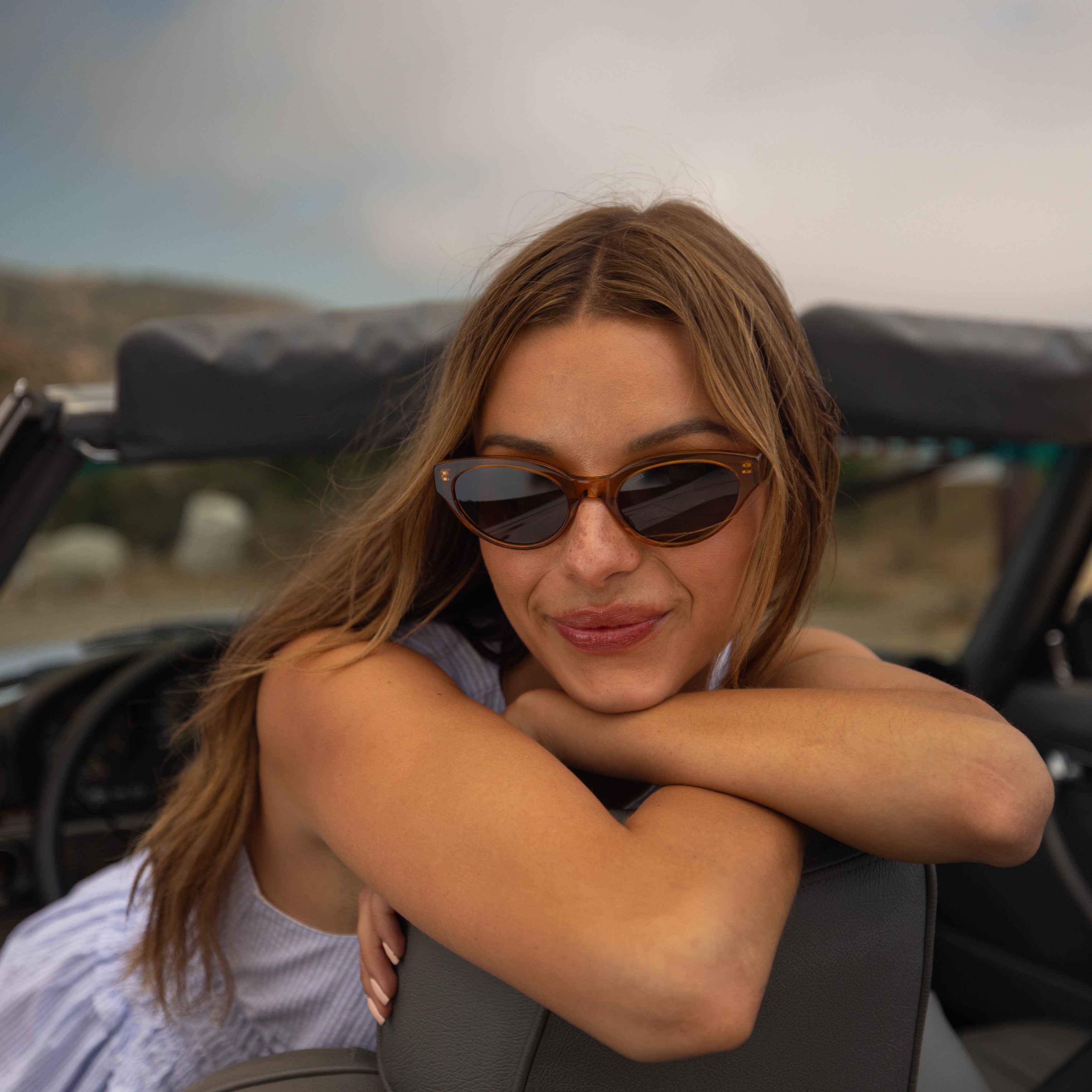 Model wearing PAIGE sunglasses in Tortoise