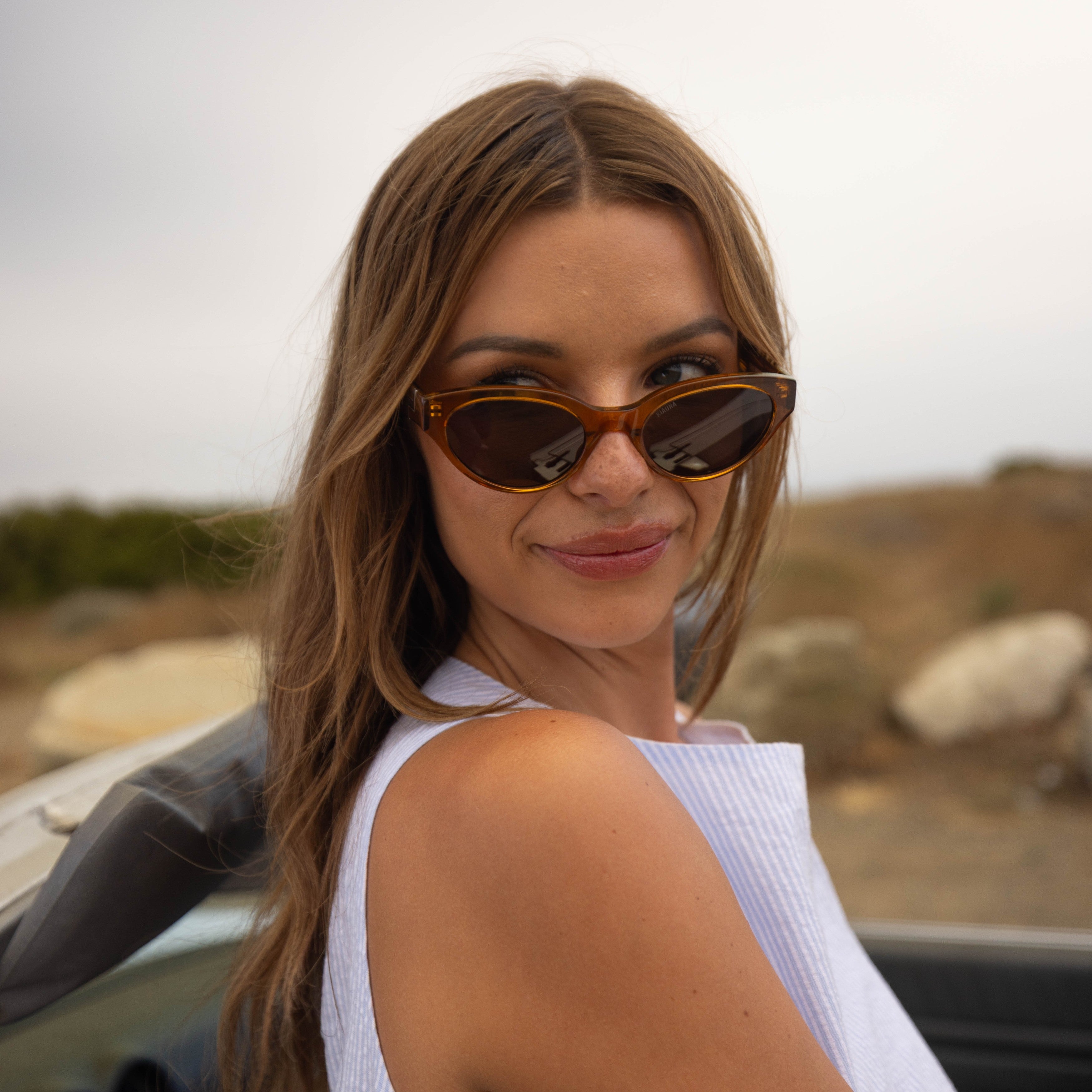 Model wearing PAIGE sunglasses in Tortoise