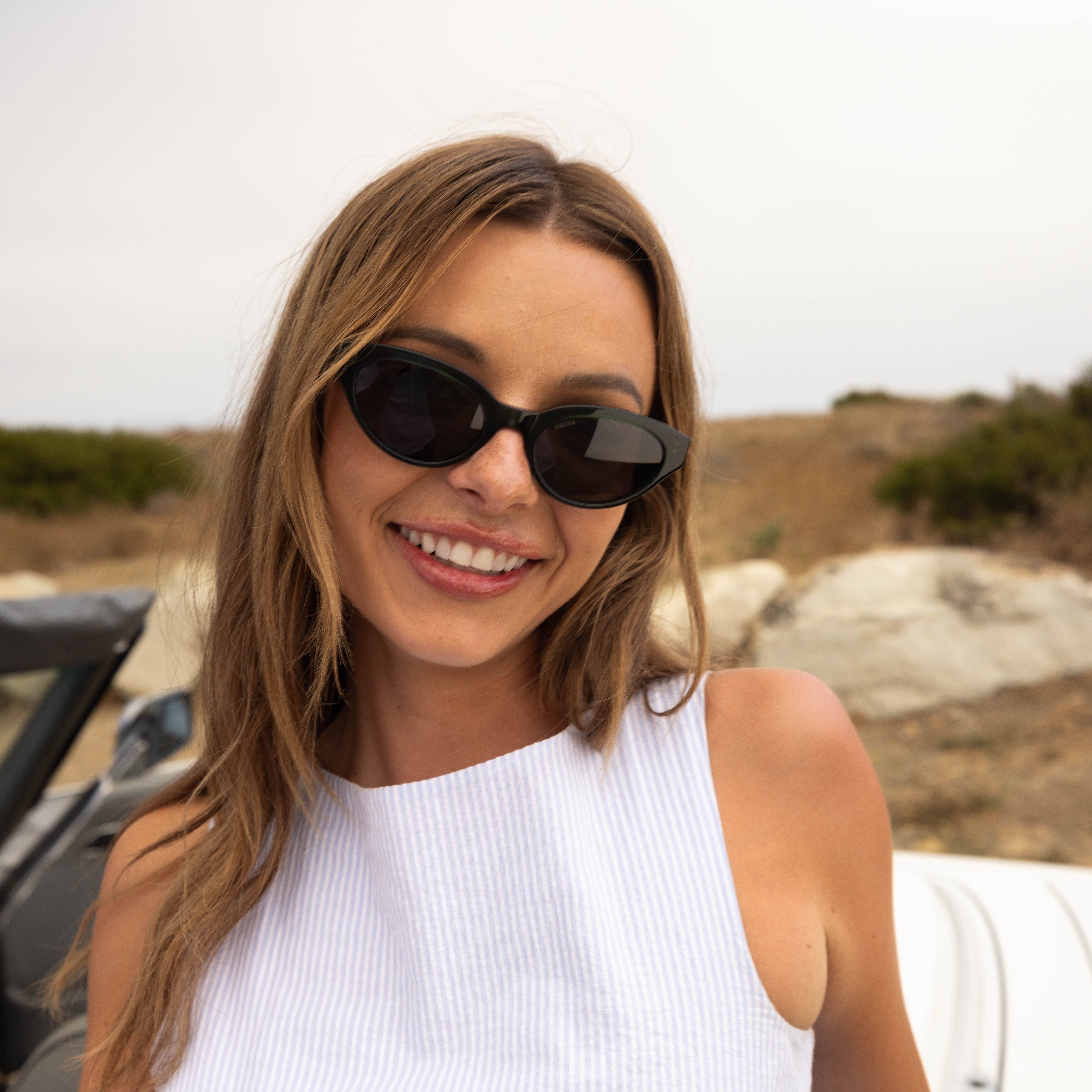 Model wearing PAIGE sunglasses in Black Crystal