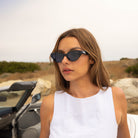 Model wearing PAIGE sunglasses in Black Crystal