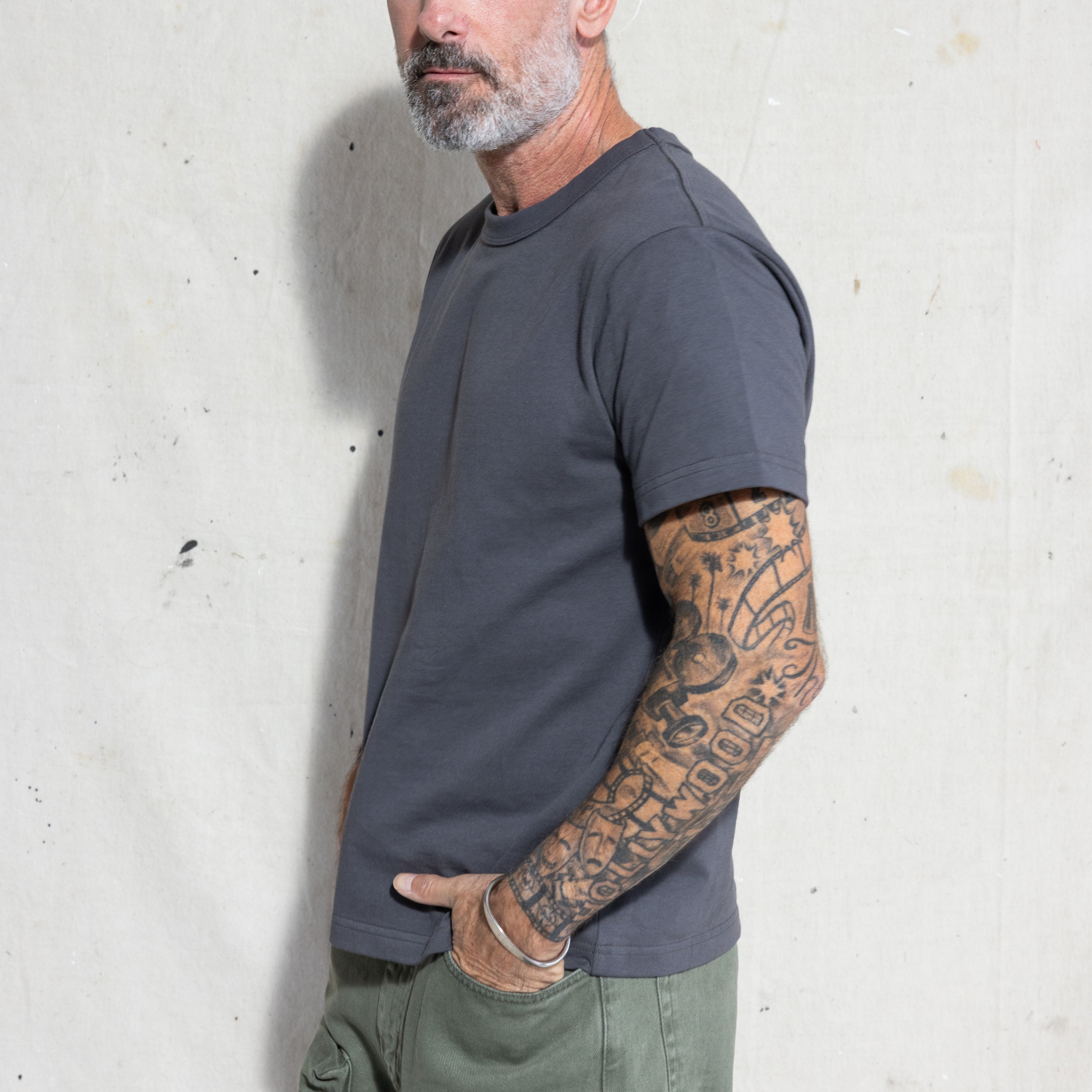 Premium Fitted Heritage Tee in Washed Black, side view on model