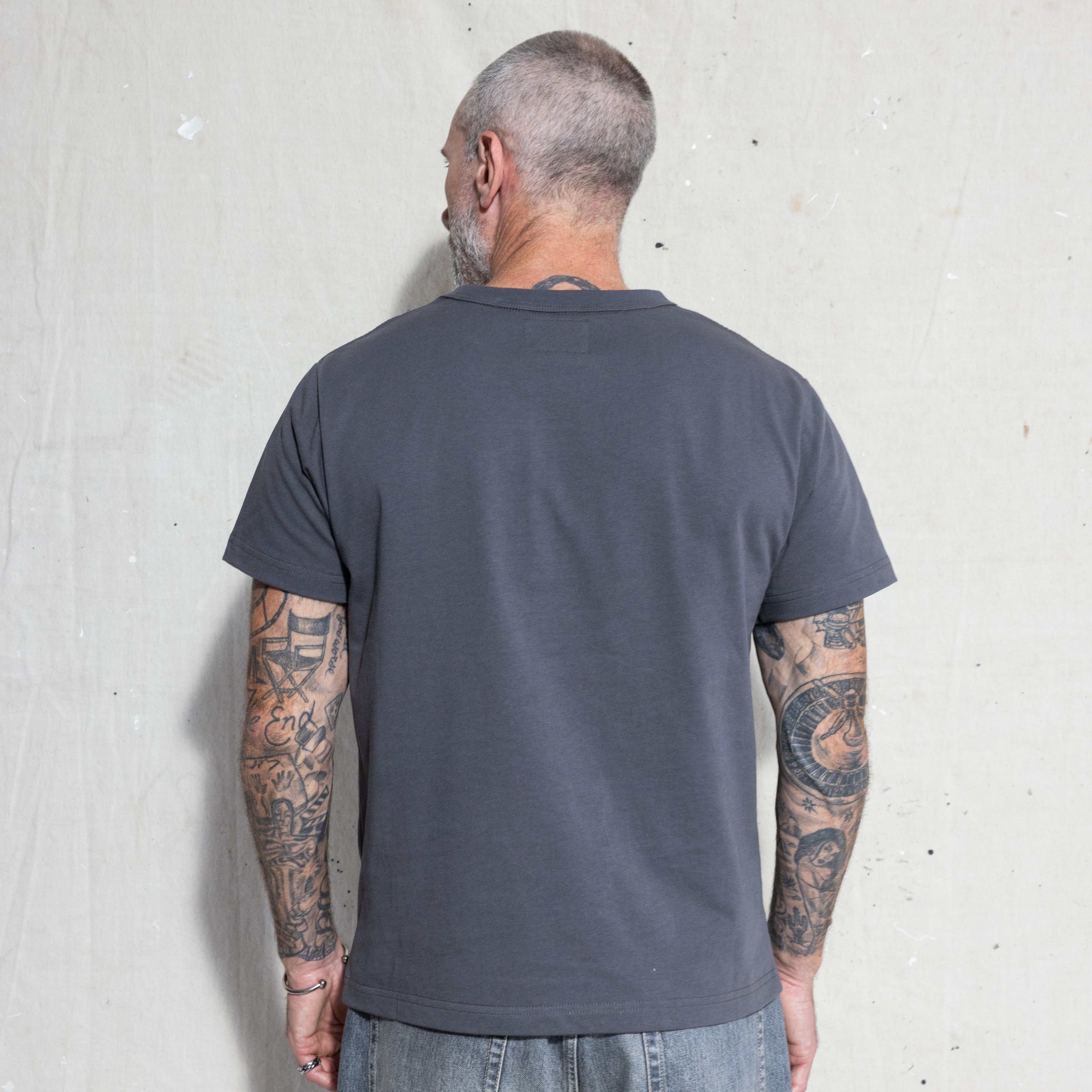 Premium Fitted Heritage Tee in Washed Black, back view on model