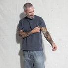 Premium Fitted Heritage Tee in Washed Black, sleeve detail on model
