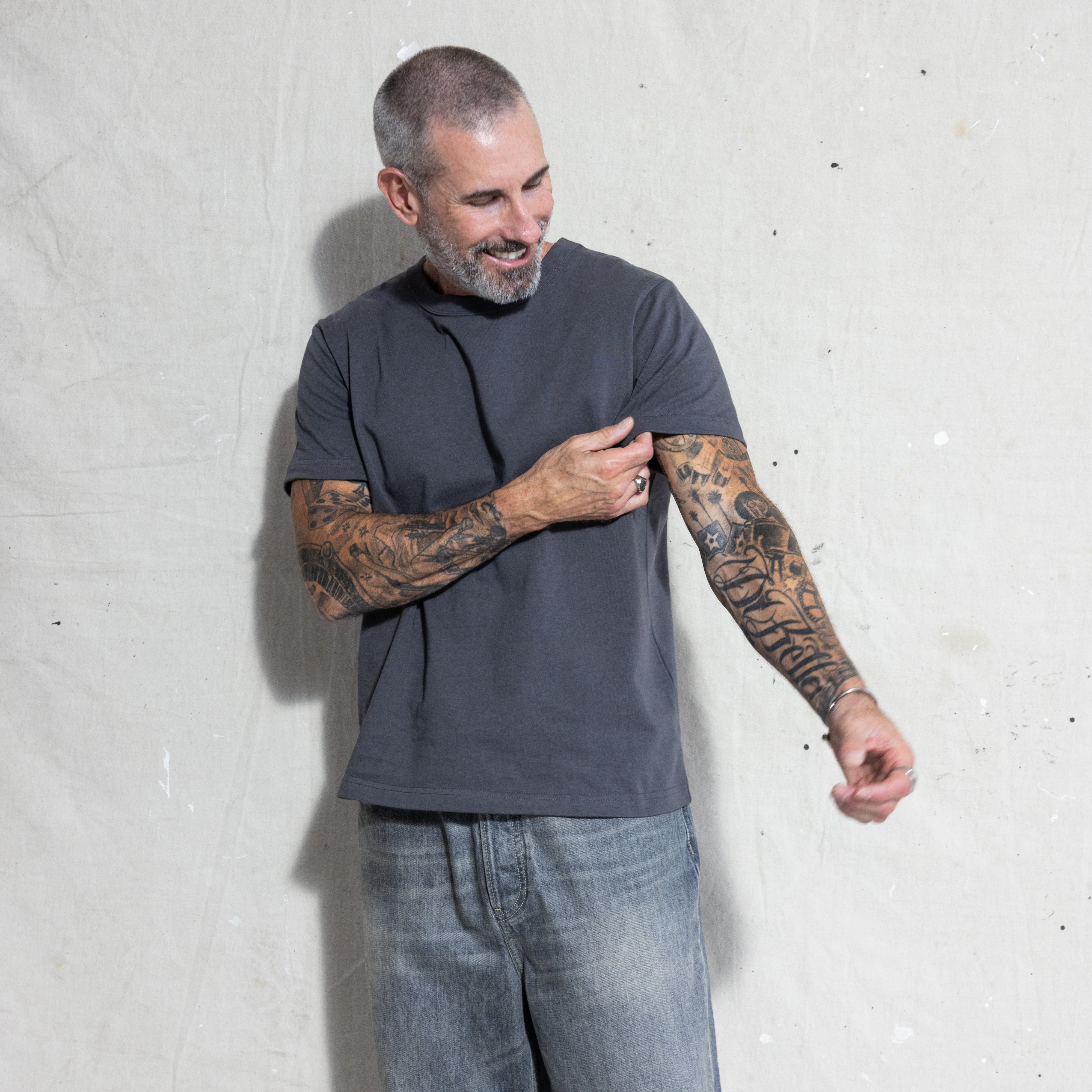 Premium Fitted Heritage Tee in Washed Black, sleeve detail on model