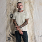 Premium Fitted Heritage Tee in Heritage Sand, front view on model, three quarter