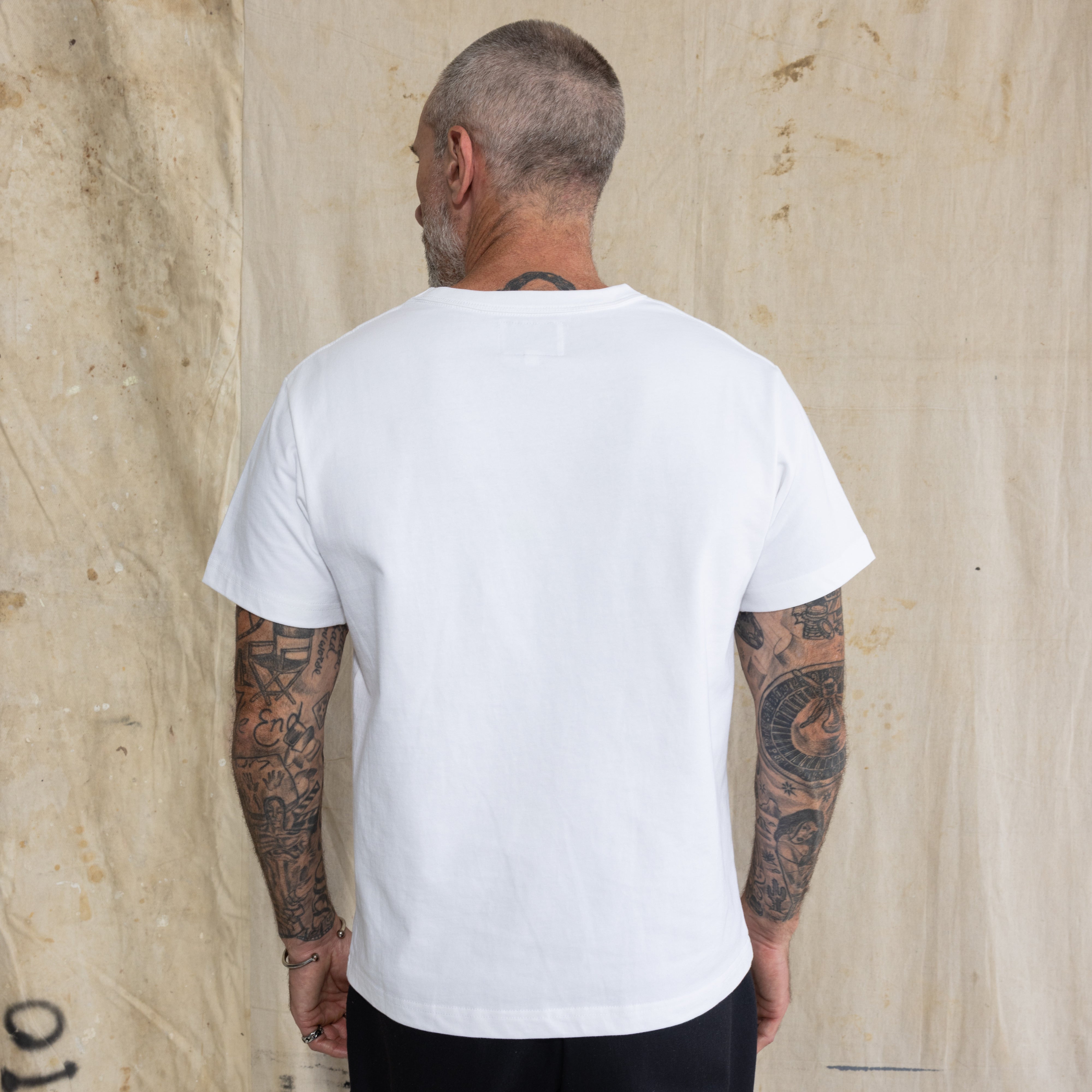 Premium Fitted Heritage Tee in Vintage White, back view on model